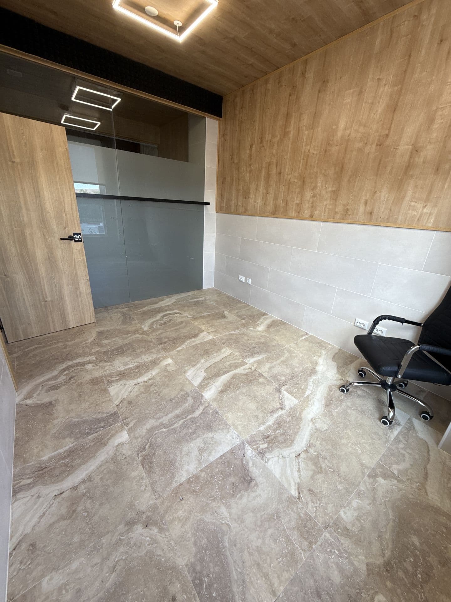 One of CoWork Altea's private offices, wood-panelled with its own glass-doored entrance