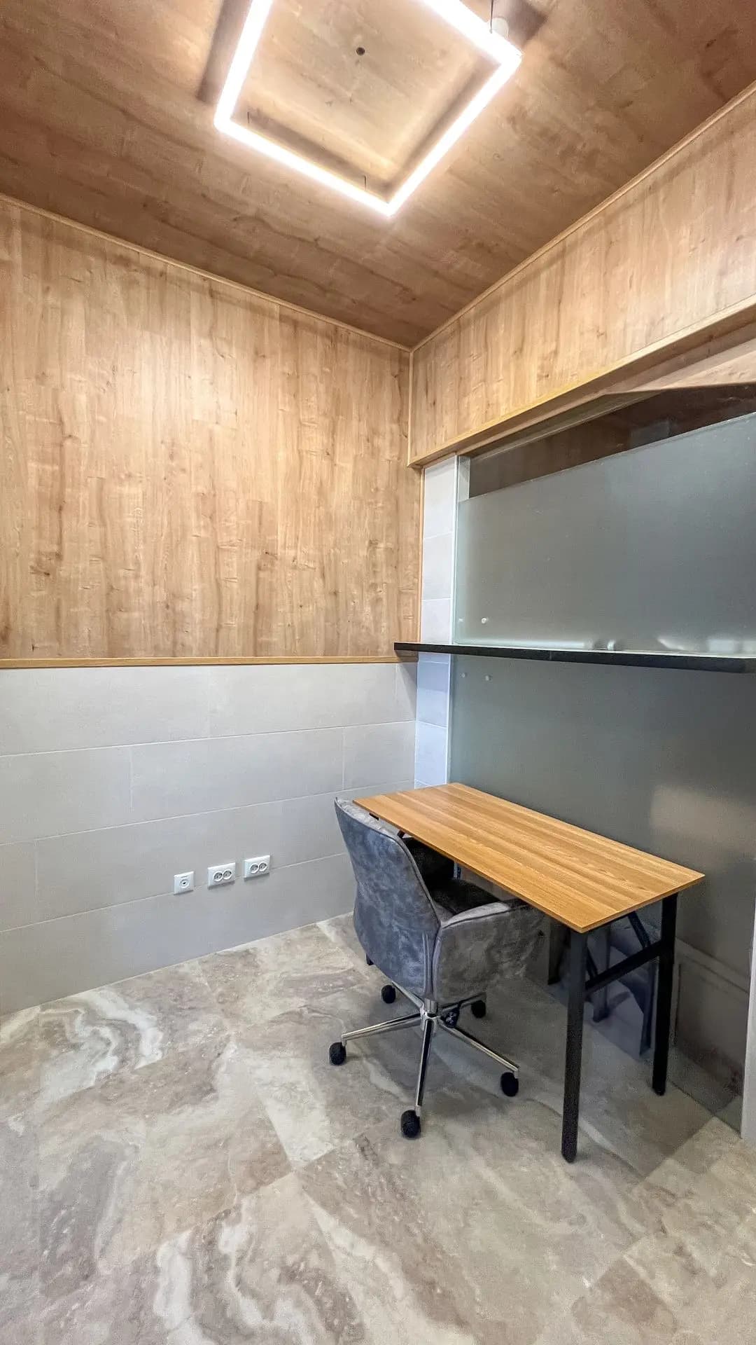 Single private office with a wooden desk